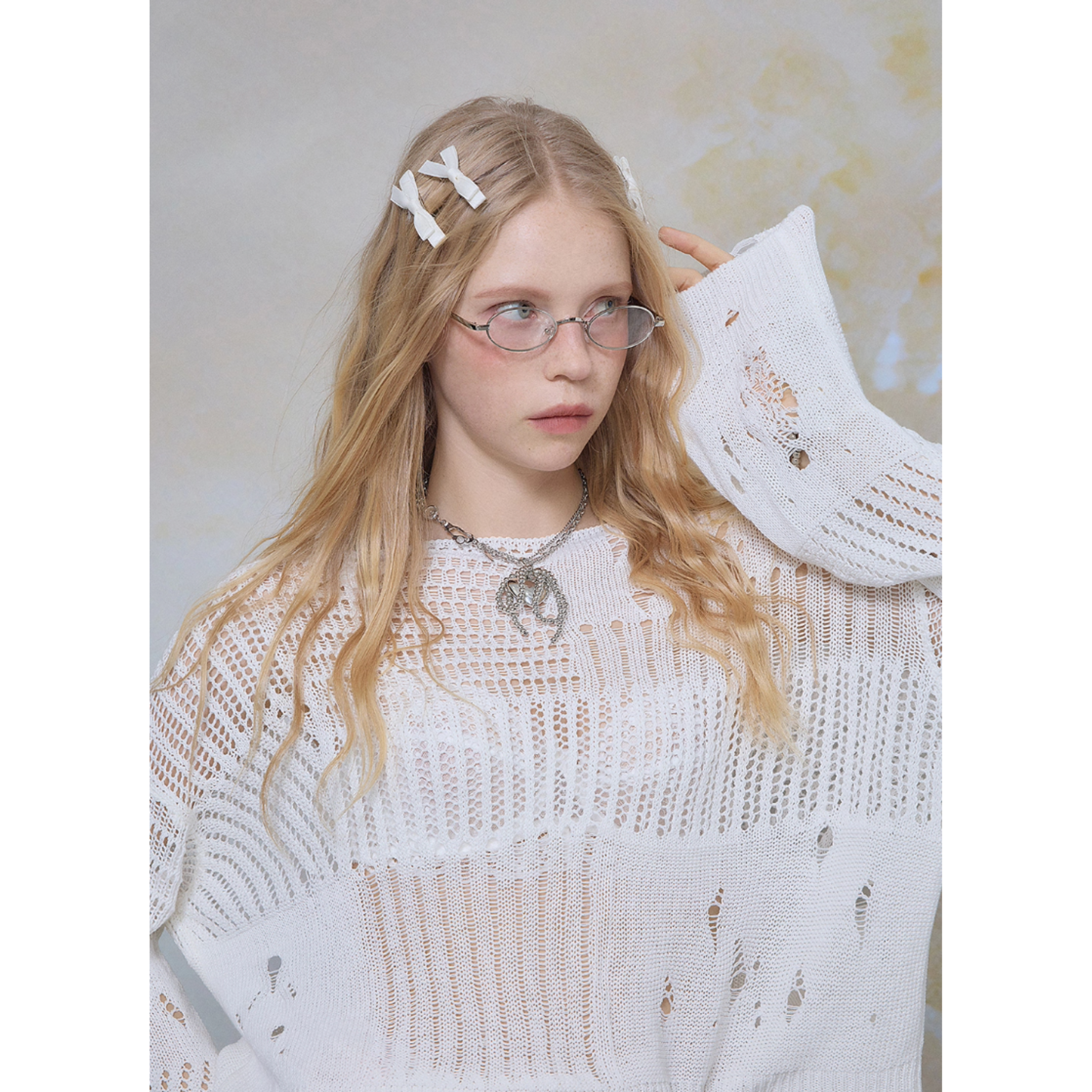 Distressed mesh knit top
